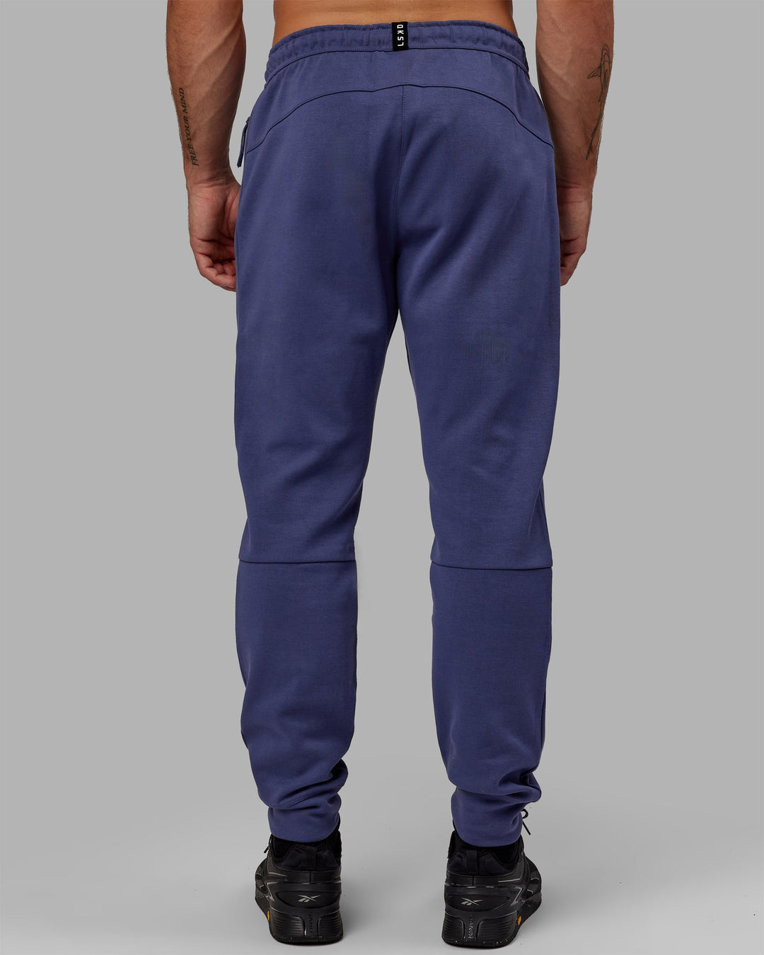 Man wearing Athlete ForgedFleece Zip Jogger - Future Dusk