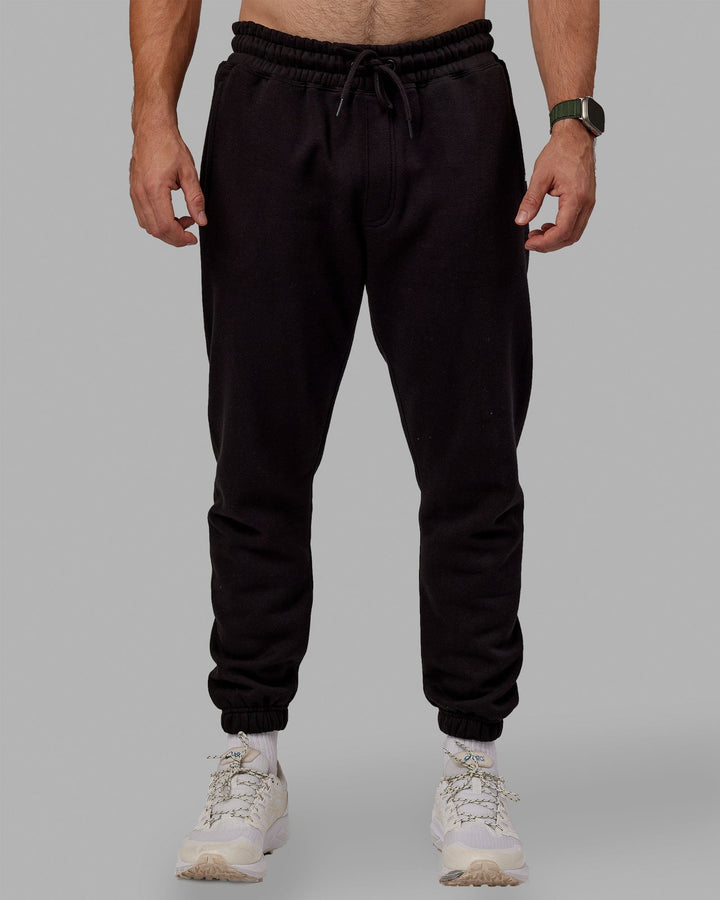 Man wearing MVP Track Pants - Black
