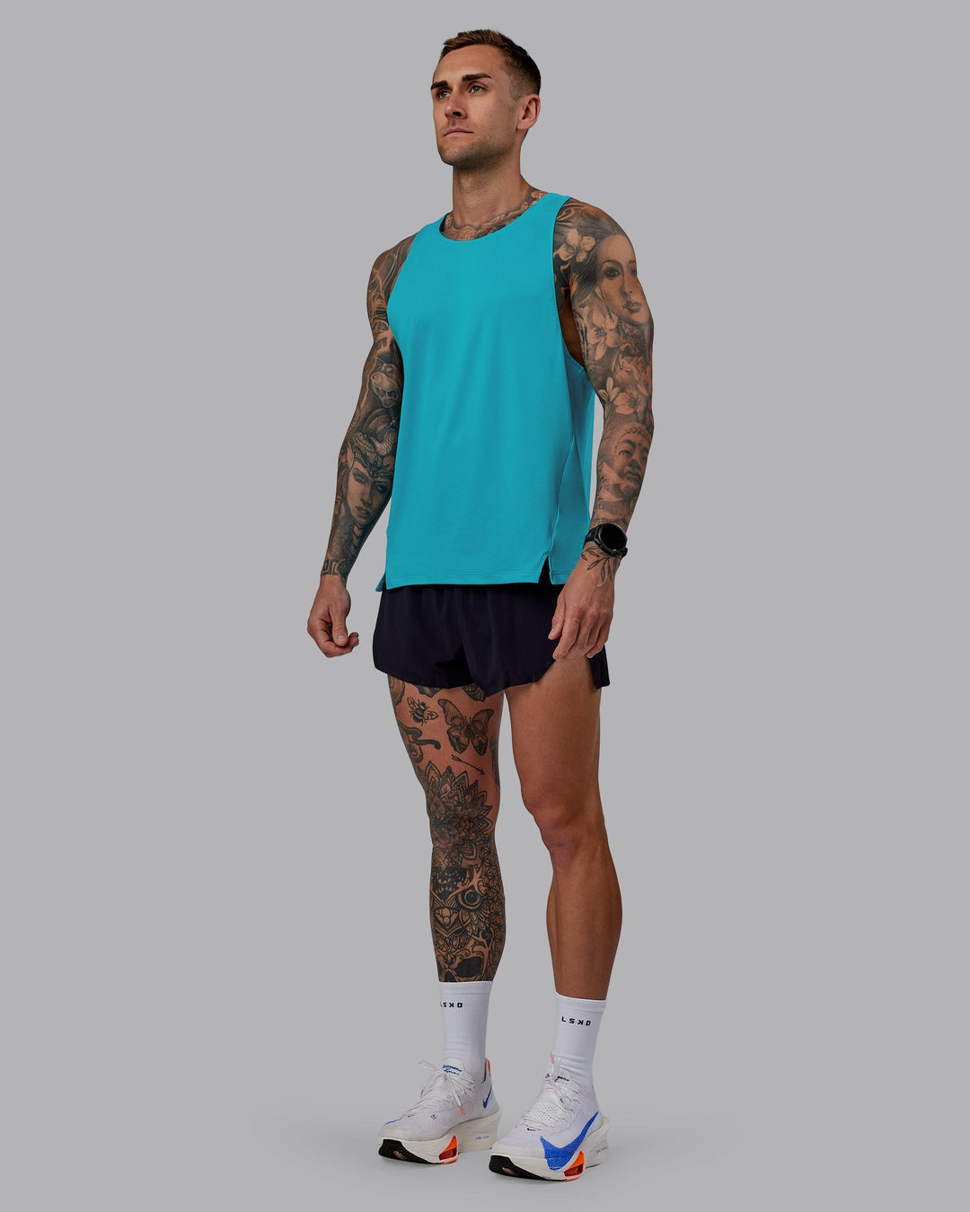 Man wearing Pace Running Tank - Blue Bird