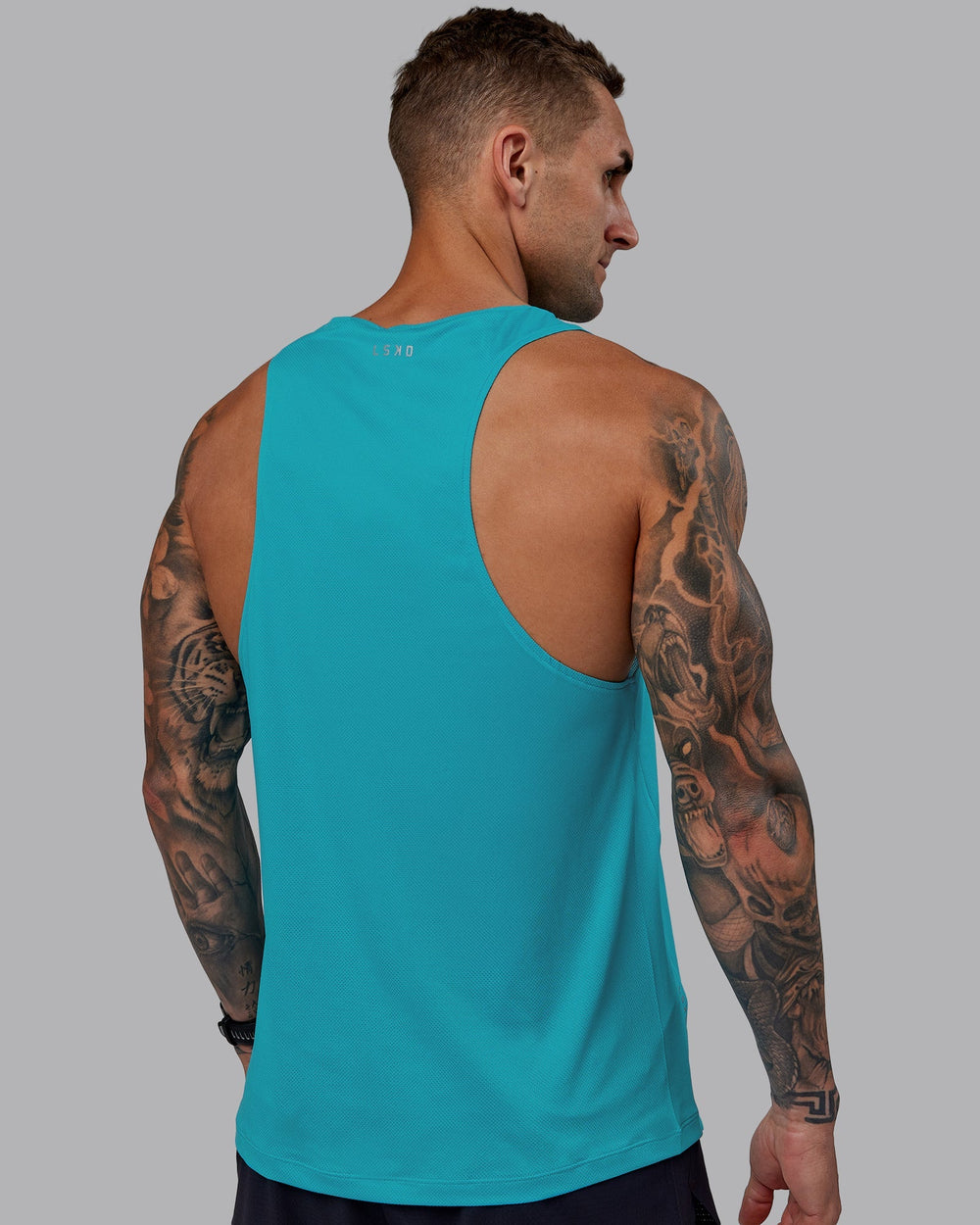 Man wearing Pace Running Tank - Blue Bird