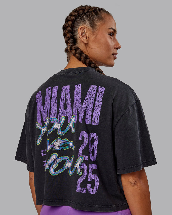 Woman wearing Miami 2025 FLXCotton Cropped Tee - Black-Purple Swirl
