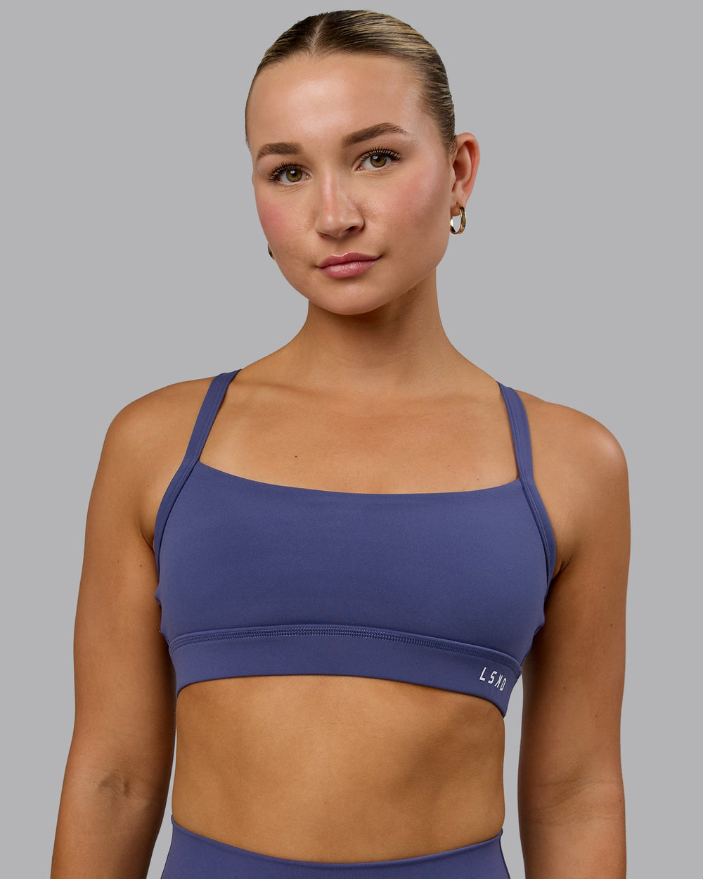 Woman wearing Momentum Sports Bra - Future Dusk