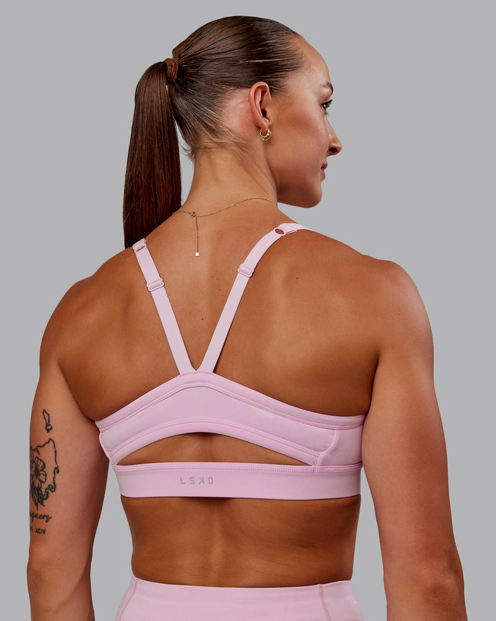 Woman wearing Momentum Sports Bra - Marshmallow
