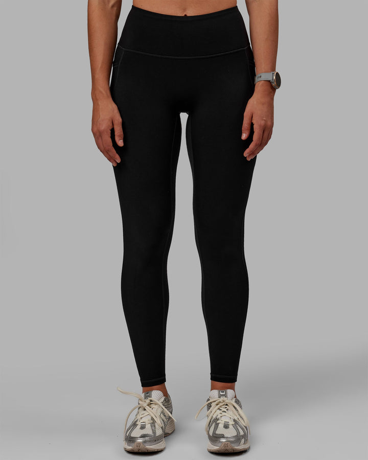 Woman wearing Motion Full Length Thermal Leggings - Black
