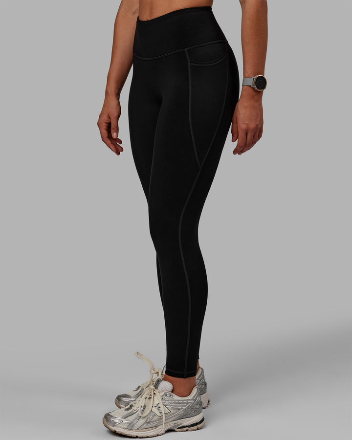 Woman wearing Motion Full Length Thermal Leggings - Black
