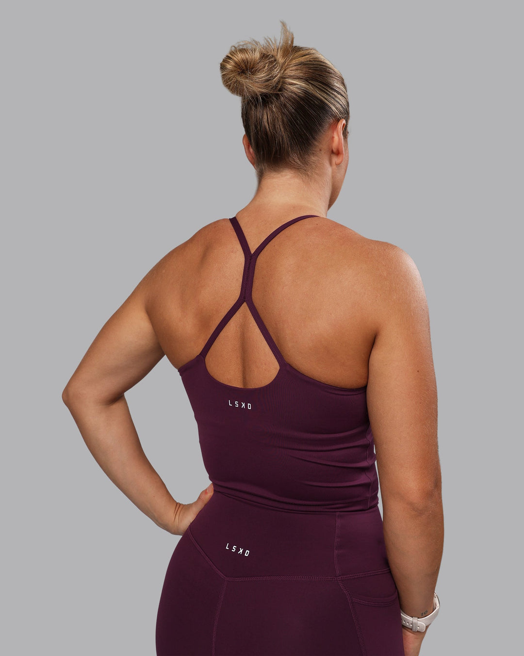 Woman wearing Movement Active Tank - Cherry Lacquer