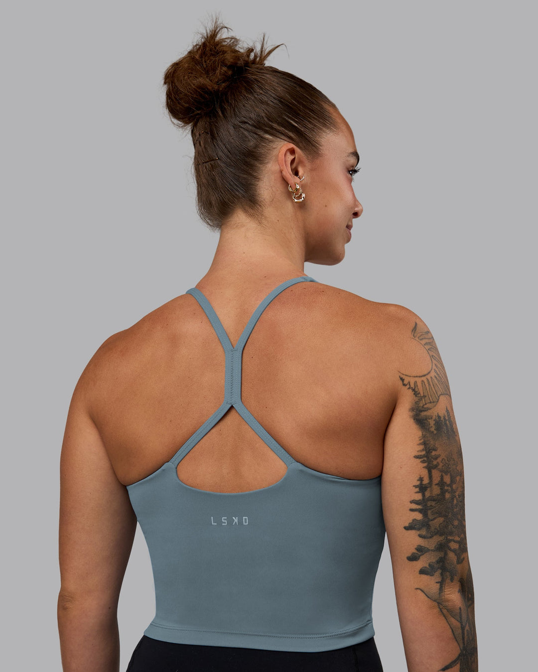 Woman wearing Movement Active Tank - Elemental Blue