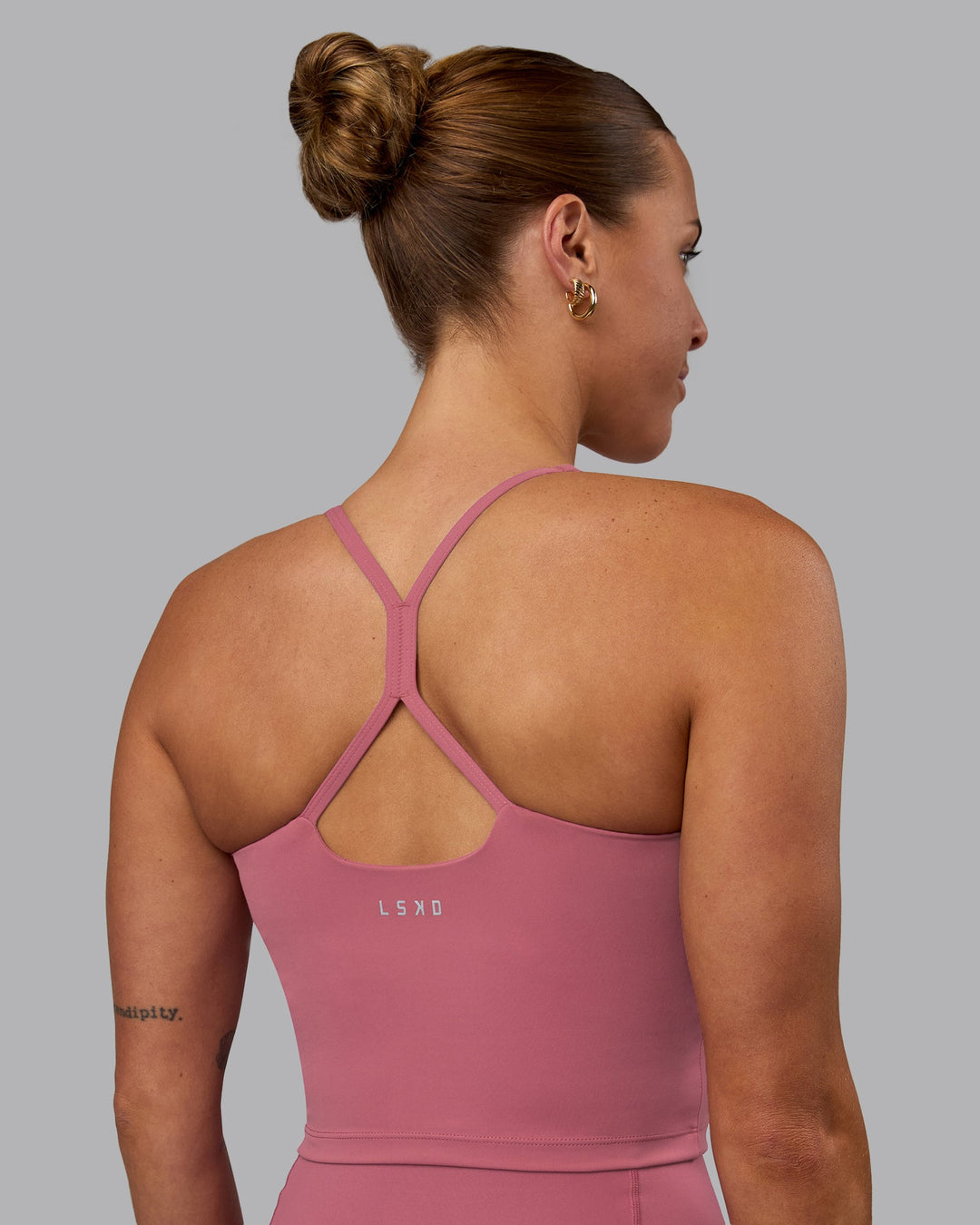 Woman wearing Movement Active Tank - Mauve Haze