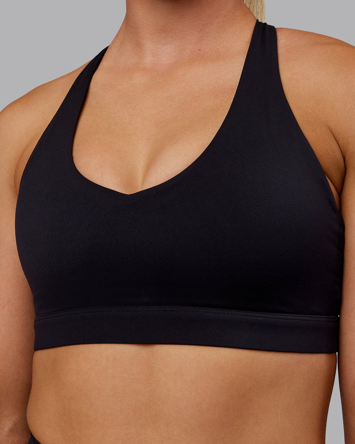 Woman wearing Nirvana Sports Bra - Black
