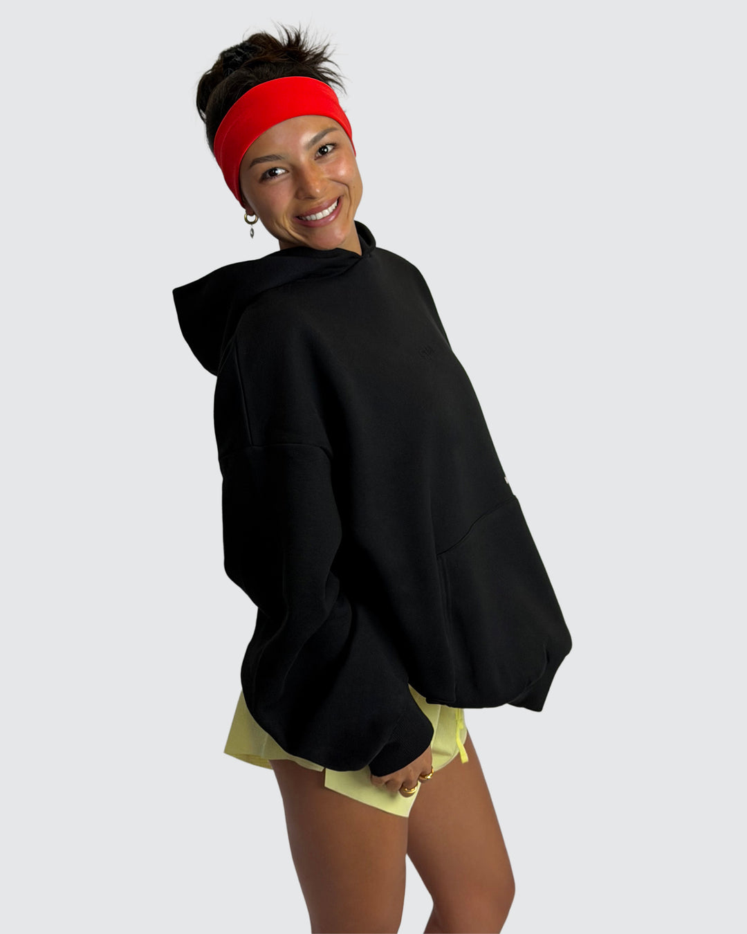 Woman wearing Oversized Apres Run Club MVP Hoodie - Black | Model:Meg | Size:XS