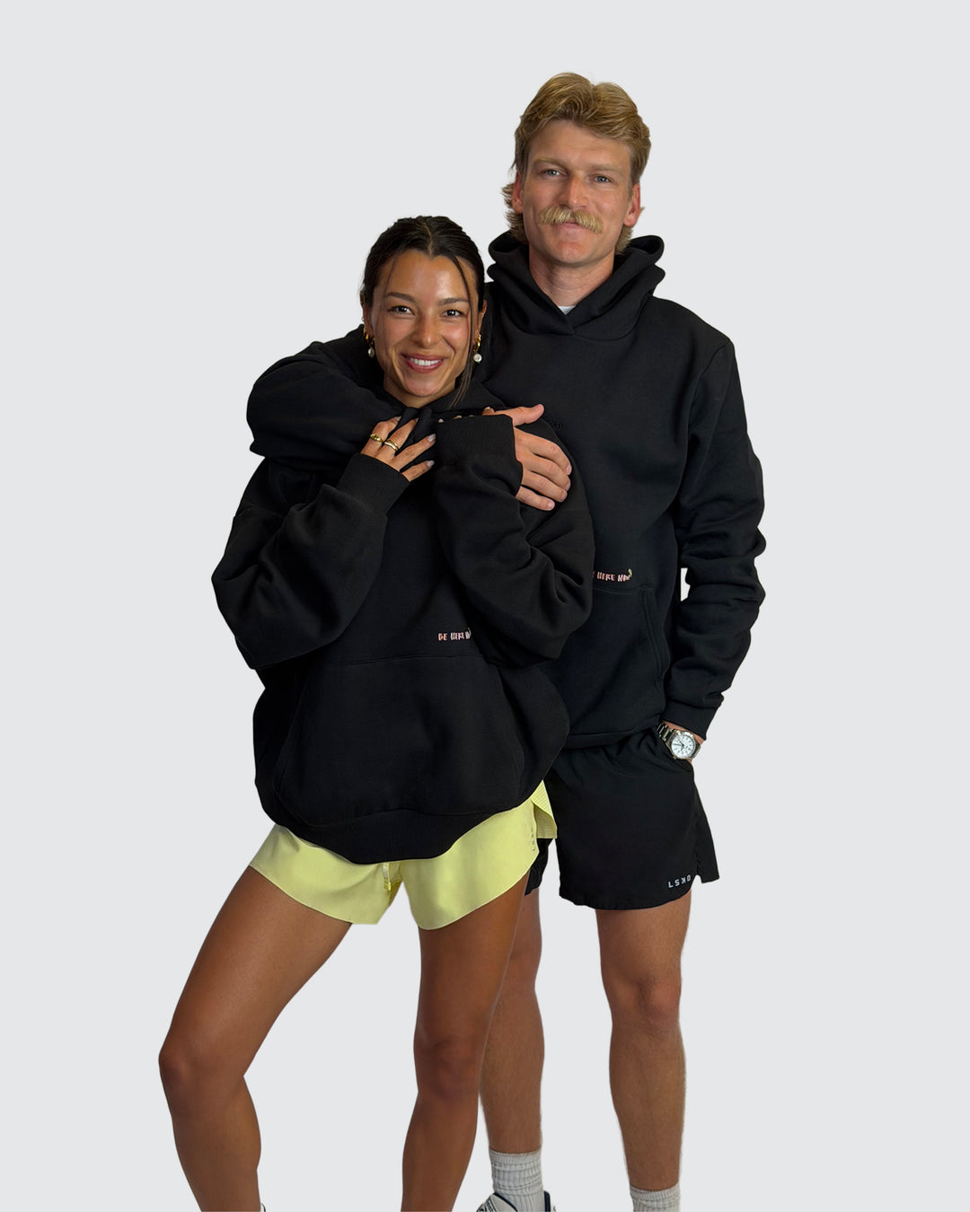 Man wearing Oversized Apres Run Club MVP Hoodie - Black