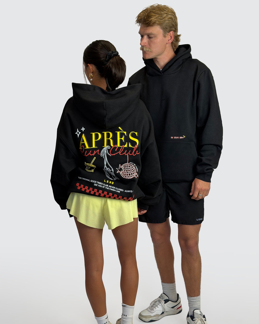 Man wearing Oversized Apres Run Club MVP Hoodie - Black