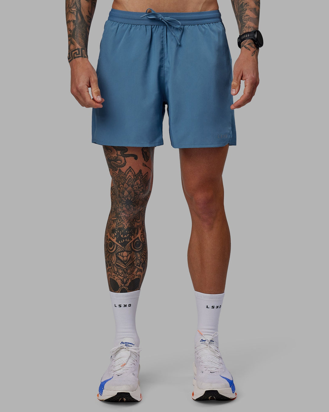 Man wearing Pace 5&quot; Lined Performance Shorts - Elemental Blue