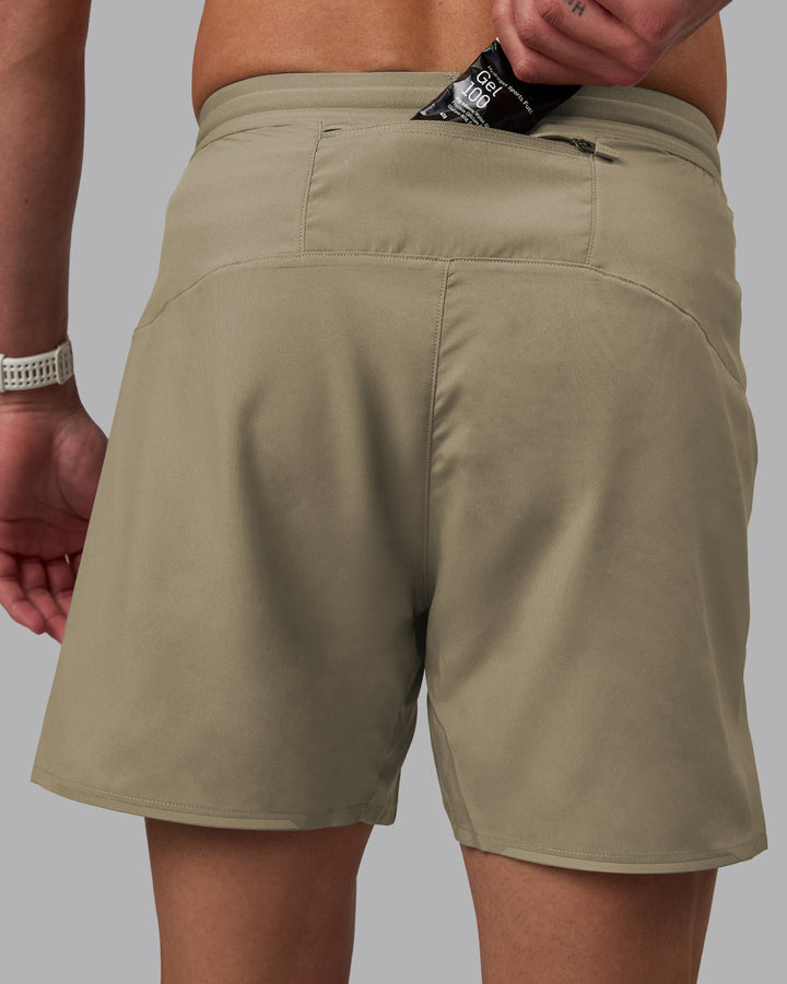 Man wearing Pace 5&quot; Lined Performance Shorts - Elephant
