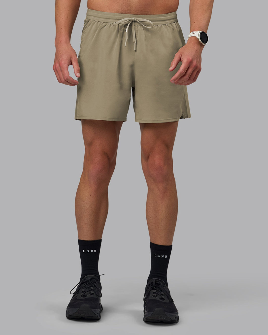 Man wearing Pace 5&quot; Lined Performance Shorts - Elephant