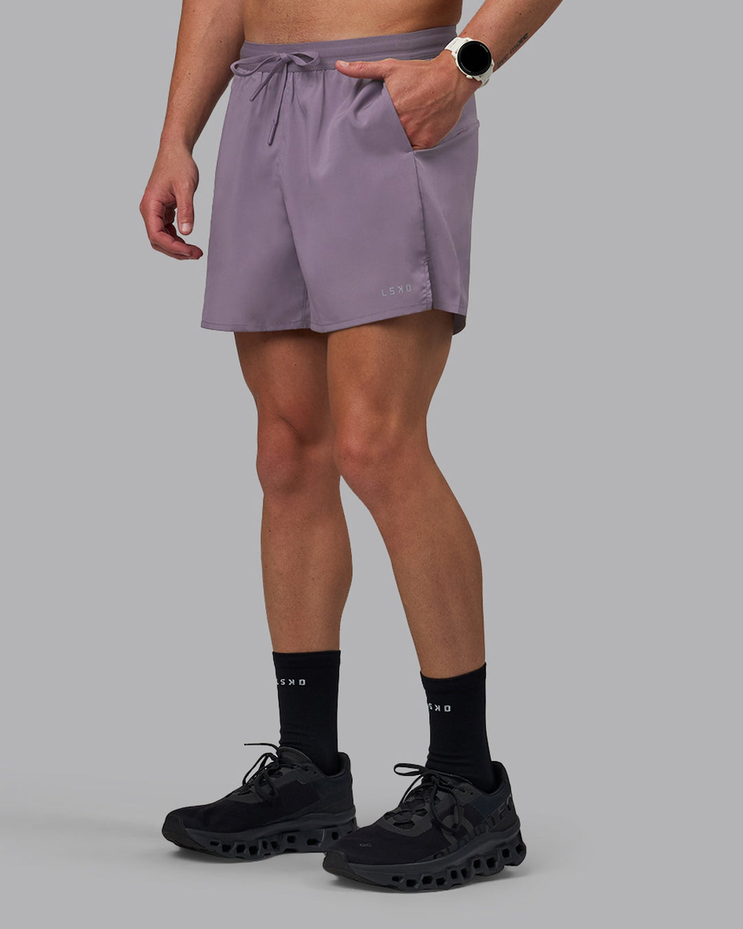 Man wearing Pace 5&quot; Lined Performance Shorts - Purple Sage