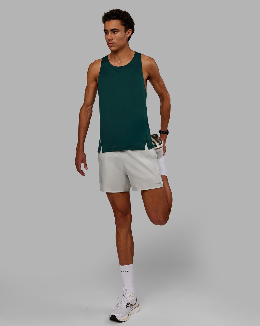 Man wearing Pace Running Tank - Dark Moss