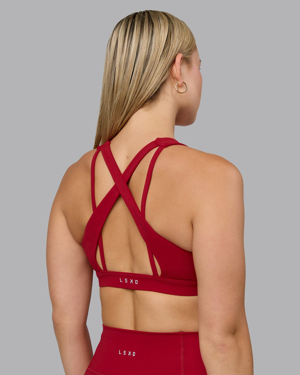 Woman wearing Pivot Sports Bra - Cherry Red