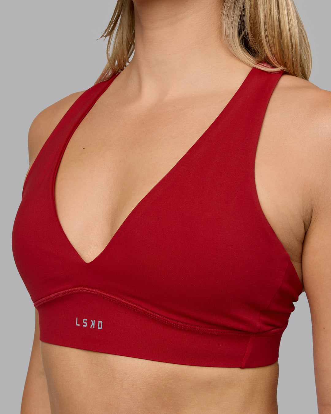 Woman wearing Poise Sports Bra - Cherry Red