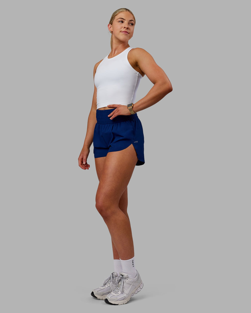 Woman wearing Power Train Shorts - Midnight Blue