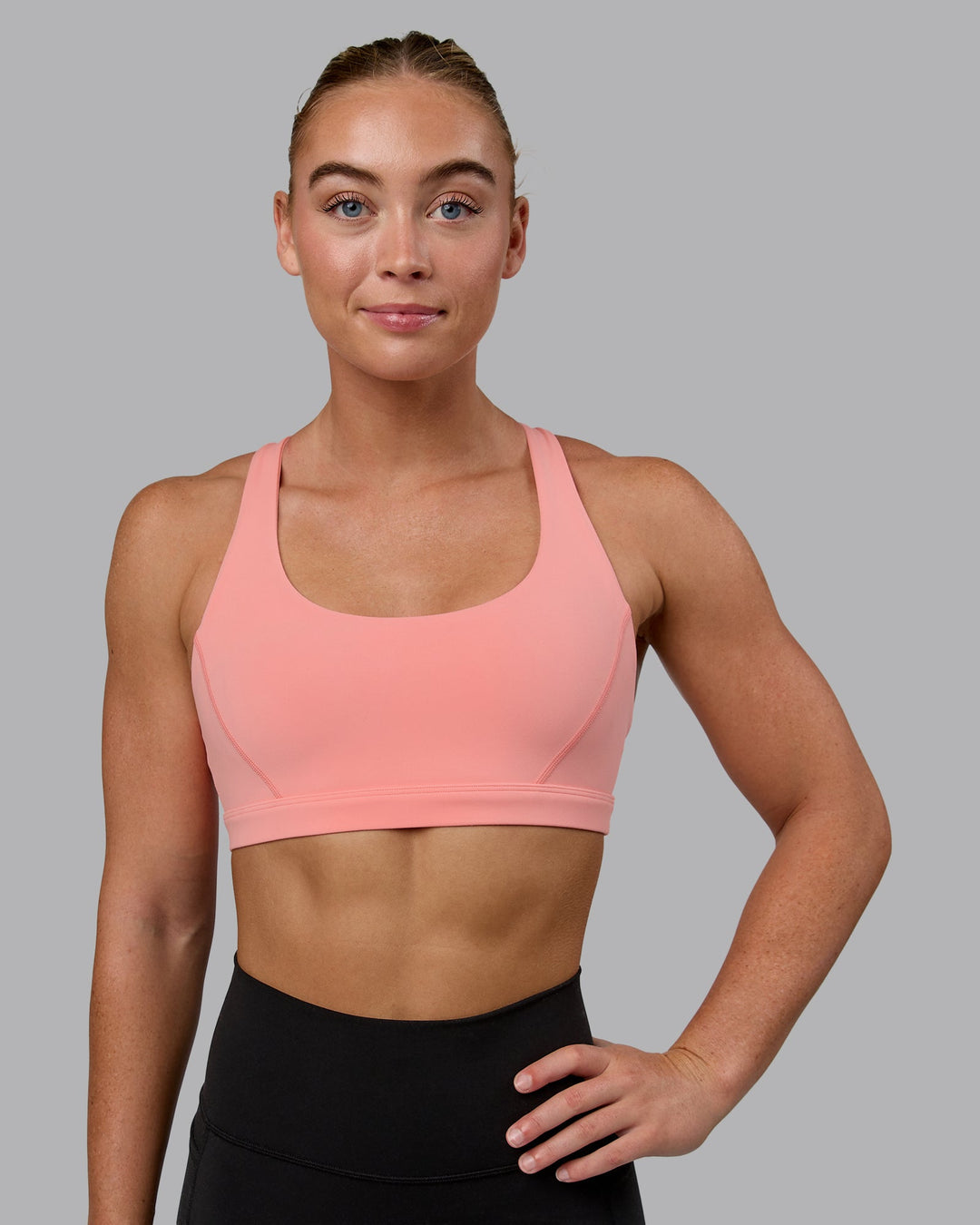 Woman wearing Precision Sports Bra - Murex Shell