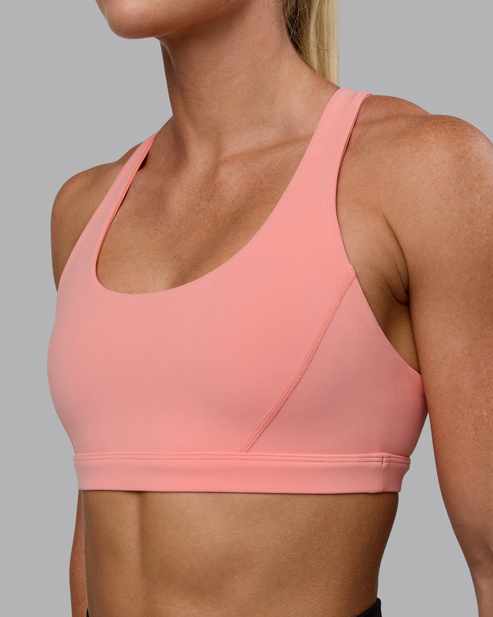 Woman wearing Precision Sports Bra - Murex Shell
