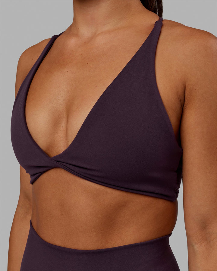 Woman wearing Progression Sports Bra - Midnight Plum