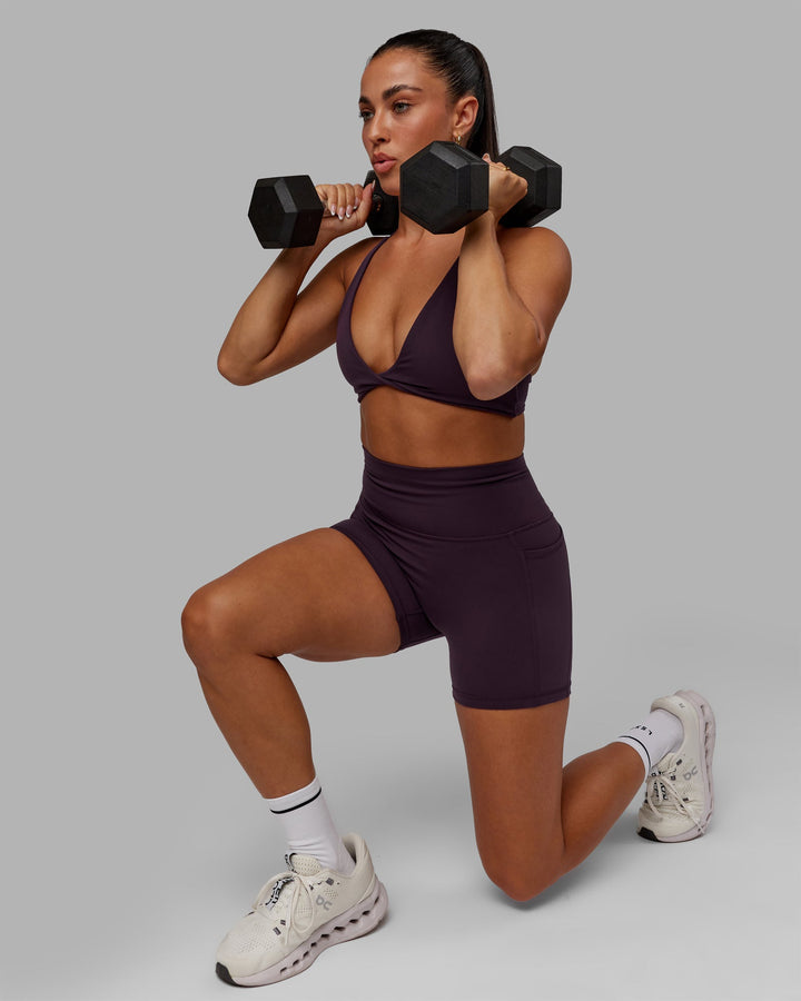 Woman wearing Progression Sports Bra - Midnight Plum