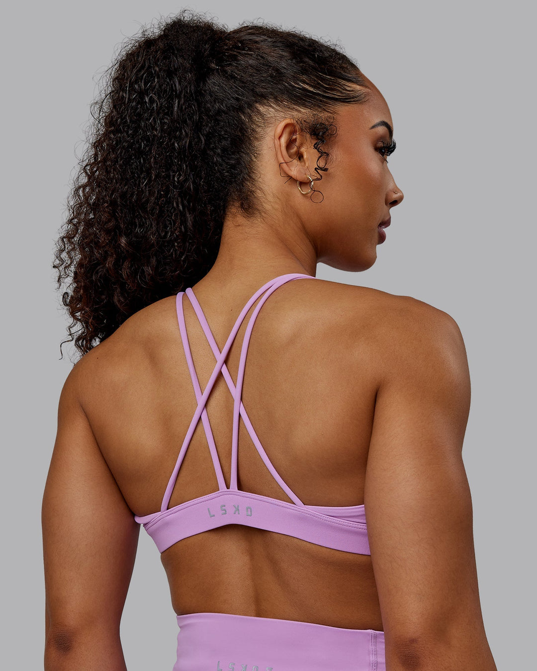 Woman wearing Pursue Sports Bra - Light Violet