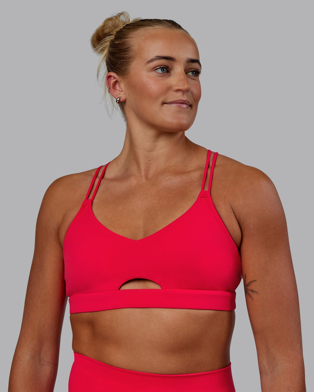 Woman wearing Pursue Sports Bra - Scarlet