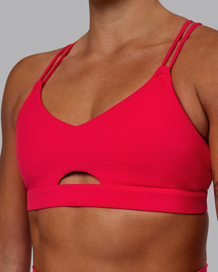 Woman wearing Pursue Sports Bra - Scarlet
