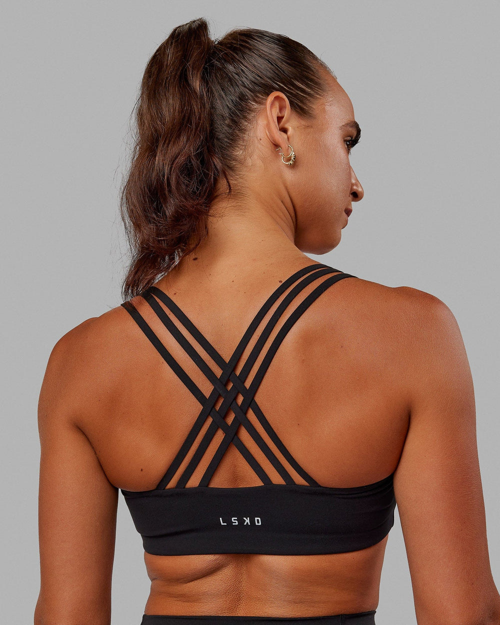 Woman wearing Push The Limit Sports Bra - Black