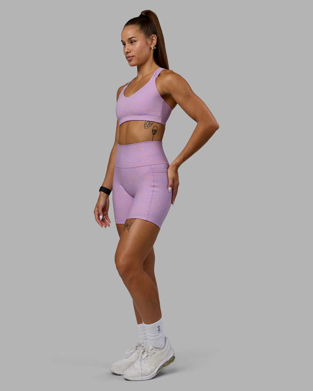 Woman wearing Push The Limit Sports Bra - Pale Lilac Vitality Print