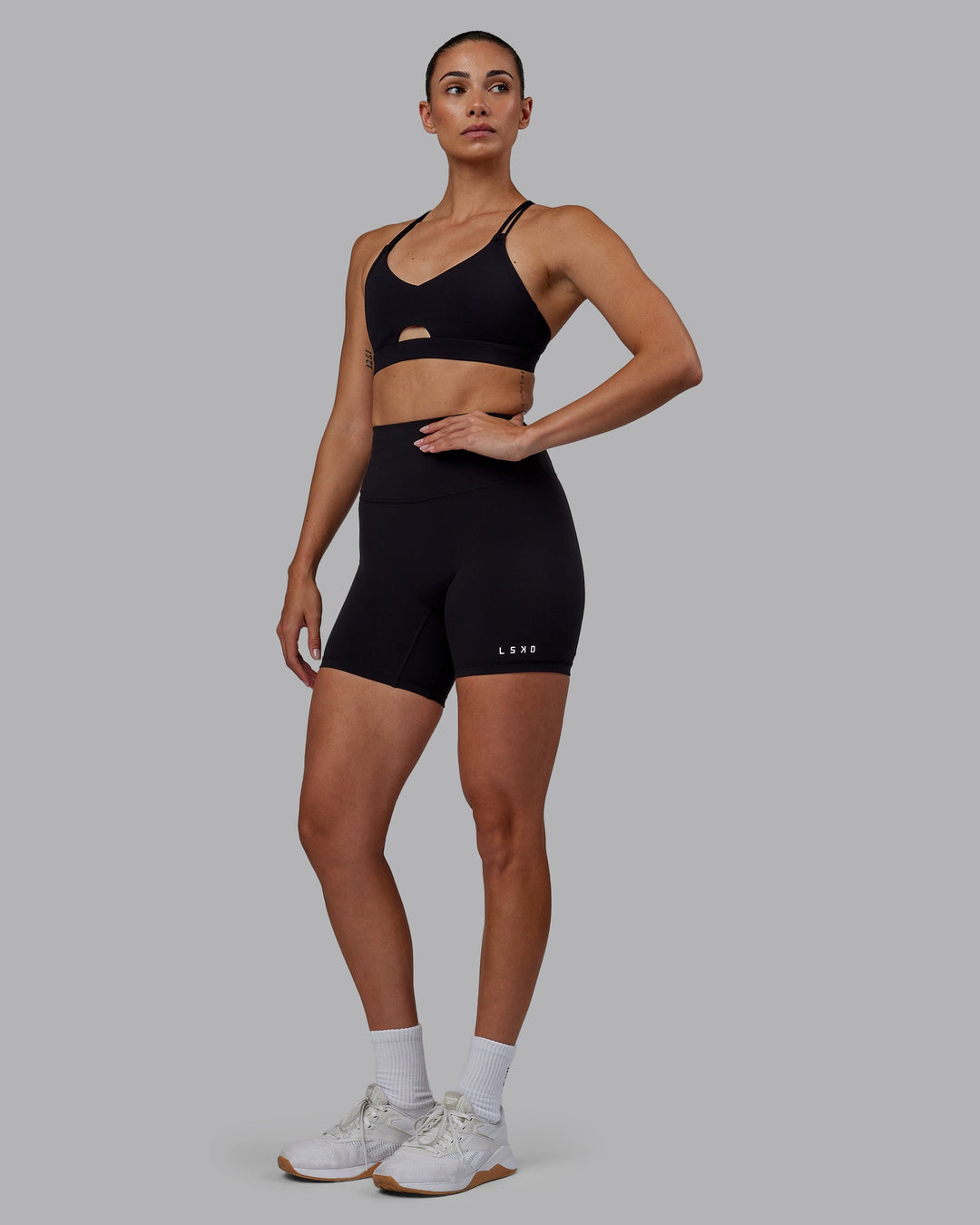 Woman wearing RXD High Waist Mid-Length Shorts - Black