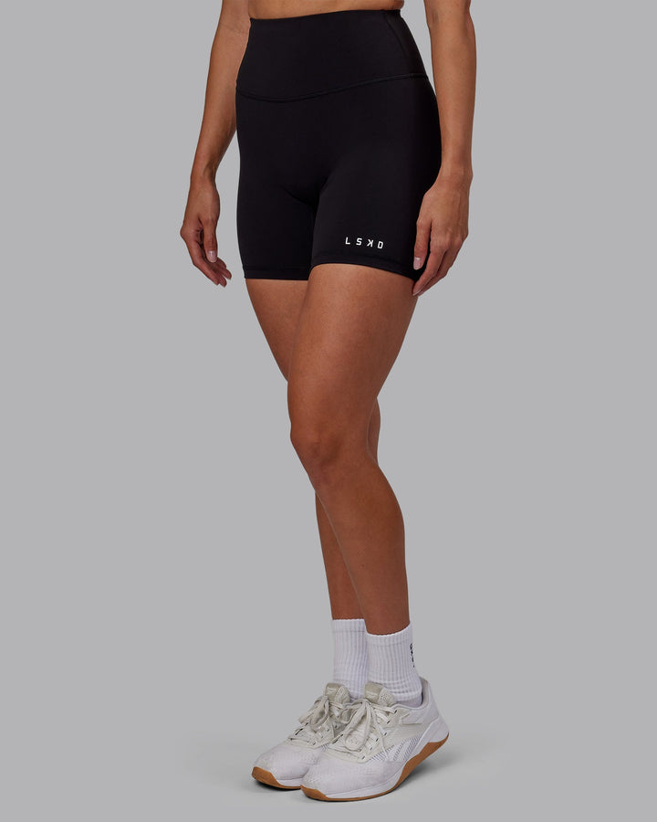 Woman wearing RXD High Waist Mid-Length Shorts - Black
