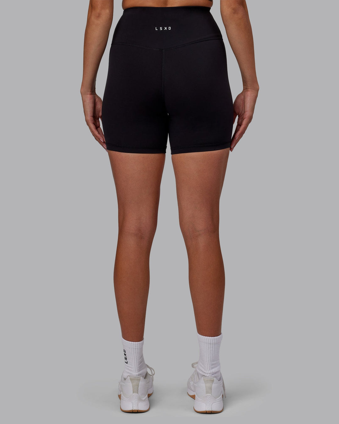 Woman wearing RXD High Waist Mid-Length Shorts - Black