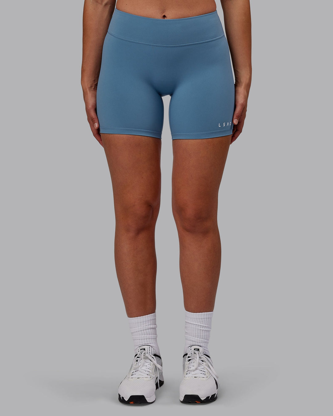 Woman wearing RXD Mid-Length Shorts - Elemental Blue