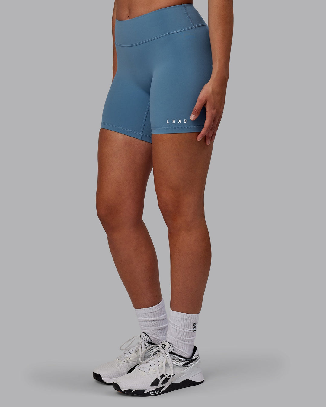 Woman wearing RXD Mid-Length Shorts - Elemental Blue