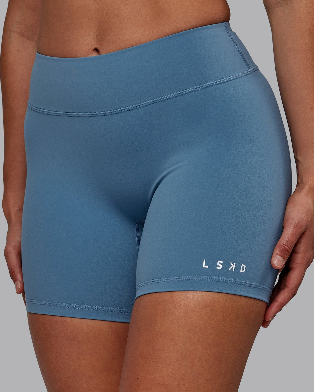 Woman wearing RXD Mid-Length Shorts - Elemental Blue