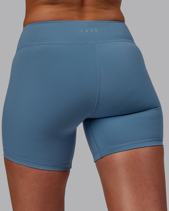 Woman wearing RXD Mid-Length Shorts - Elemental Blue
