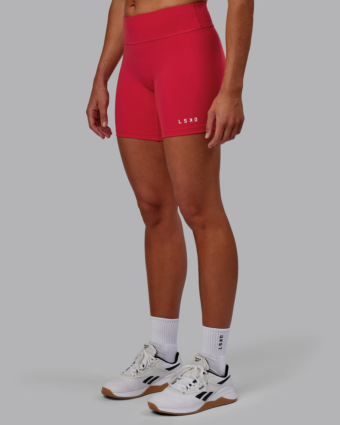 Woman wearing RXD Mid-Length Shorts - Scarlet