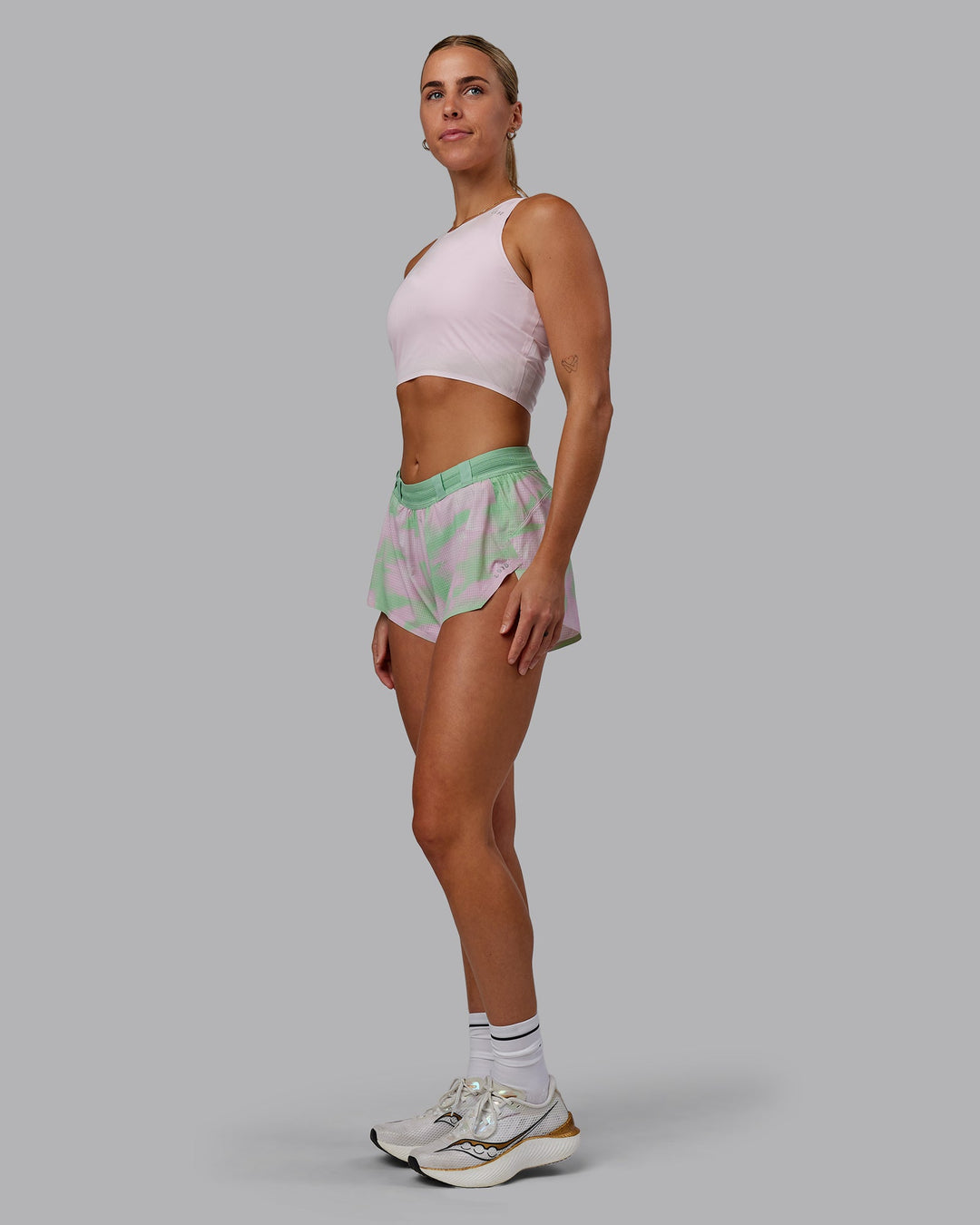 Woman wearing Race Day Cropped Performance Tank - Festival Bloom-White