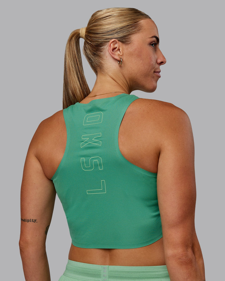 Woman wearing Race Day Cropped Performance Tank - Mystic Green-Surreal Green
