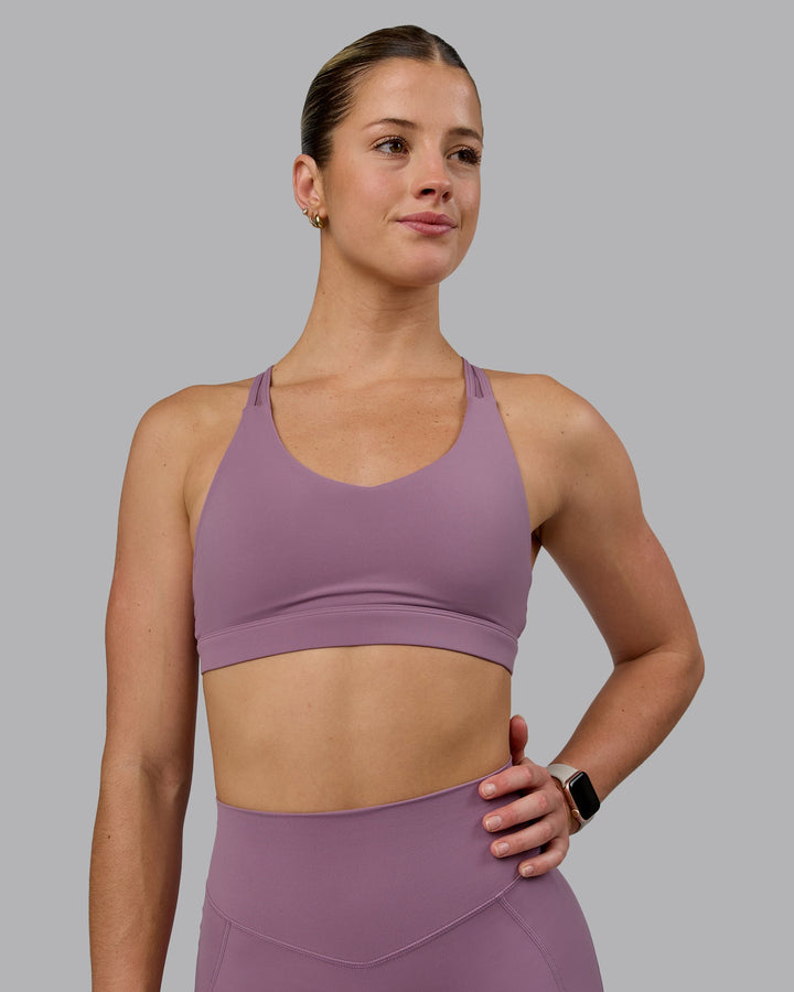 Woman wearing Radiance Sports Bra - Grape
