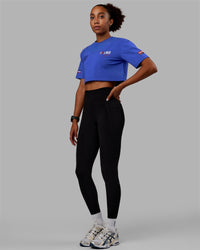Woman wearing Redline FLXCotton Cropped Tee - Power Cobalt-White