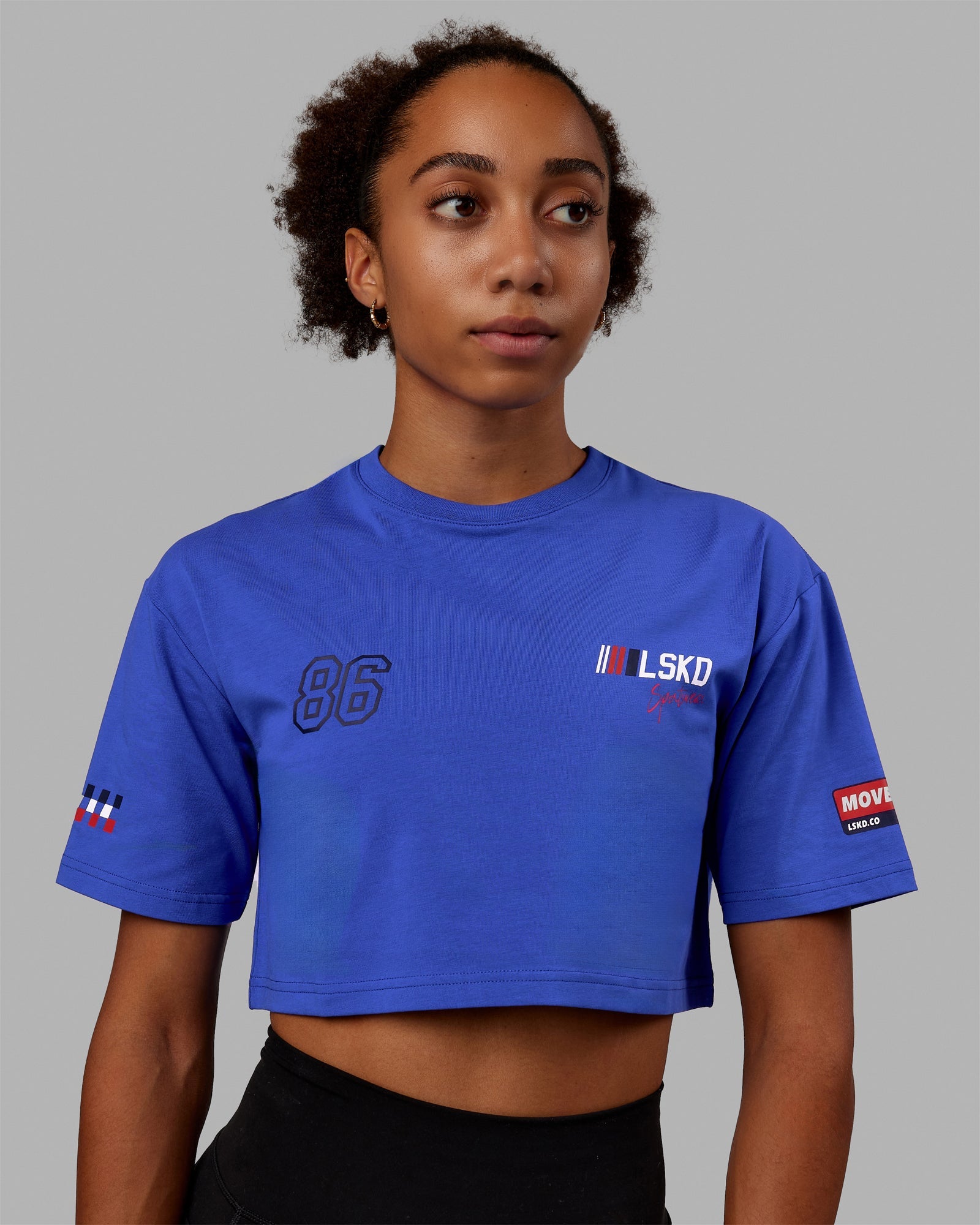 Woman wearing Redline FLXCotton Cropped Tee - Power Cobalt-White