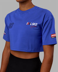 Woman wearing Redline FLXCotton Cropped Tee - Power Cobalt-White