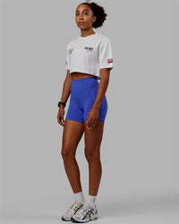 Woman wearing Redline FLXCotton Cropped Tee - White-Navy  Edit alt text