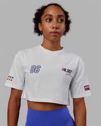 Woman wearing Redline FLXCotton Cropped Tee - White-Navy  Edit alt text