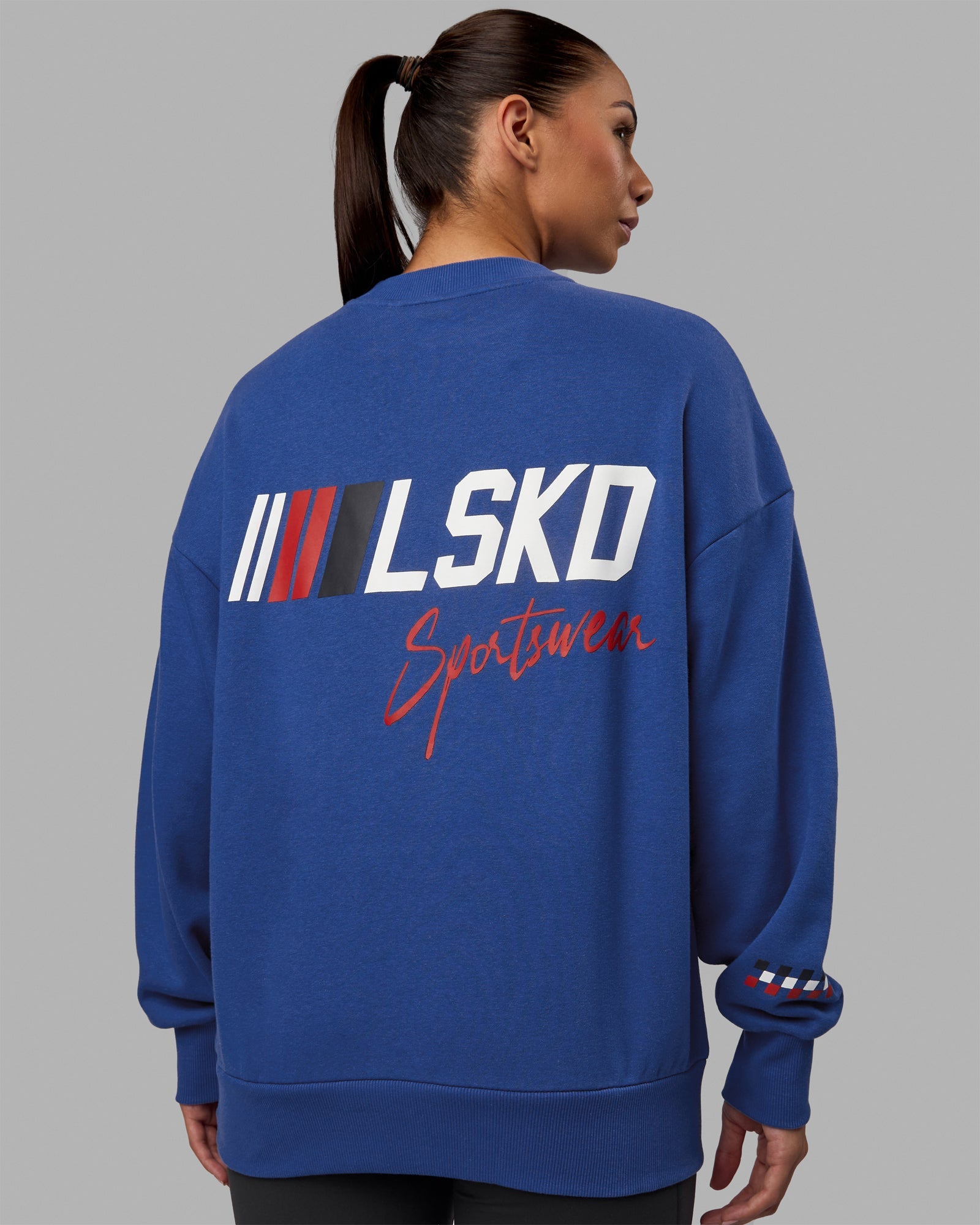 Woman wearing Unisex Redline Sweater Oversize - Power Cobalt-White